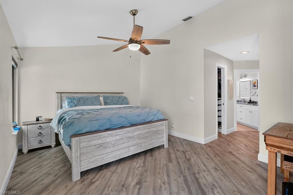 Spacious primary with views of the lake and golf course