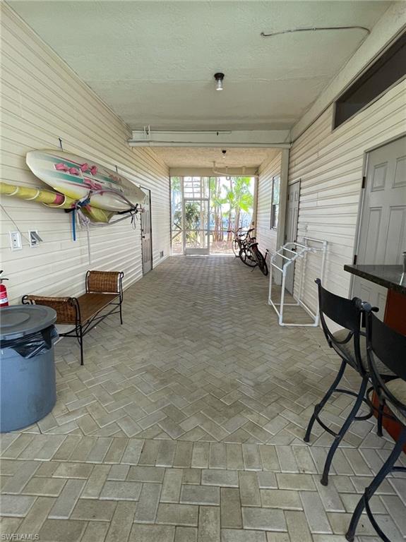View of patio / terrace featuring a sunroom