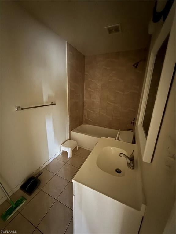 Bathroom with tile patterned floors, vanity, and bathing tub / shower combination