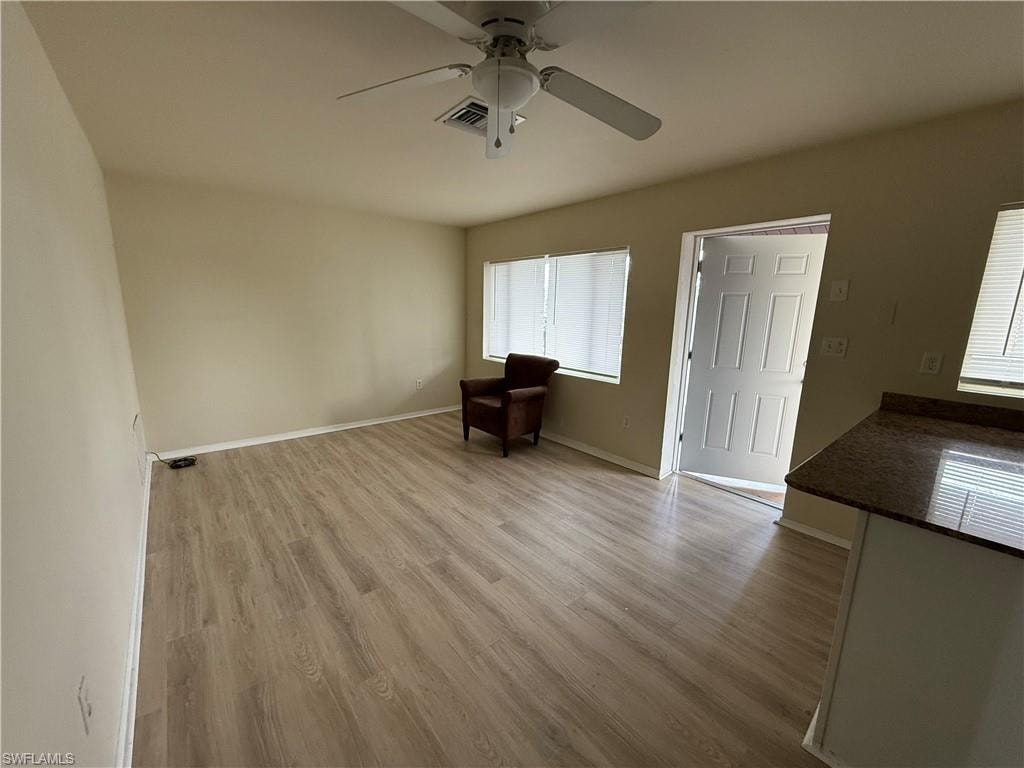 Unfurnished room featuring ceiling fan and light hardwood / wood-style floors