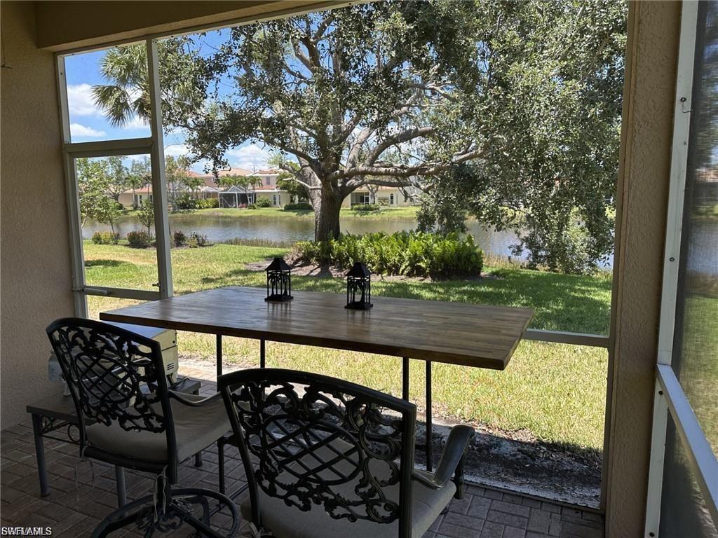 Screened lanai with paver flooring and a built-in wood-finish counter