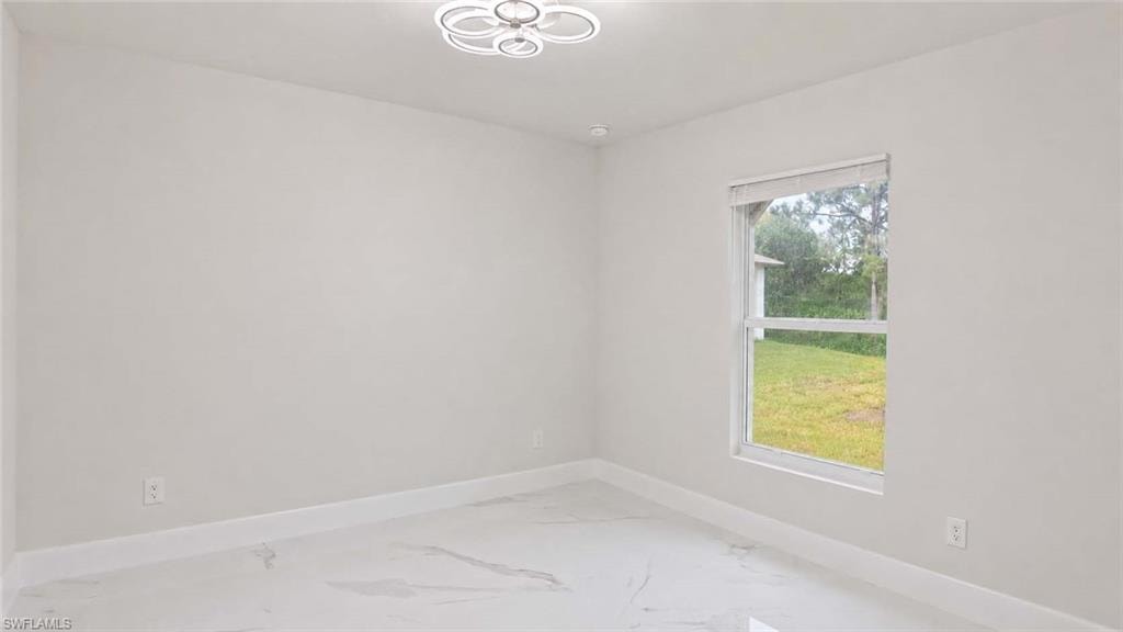 Recessed lighting, modern ceiling fixture, single window, baseboard trim, and tile flooring