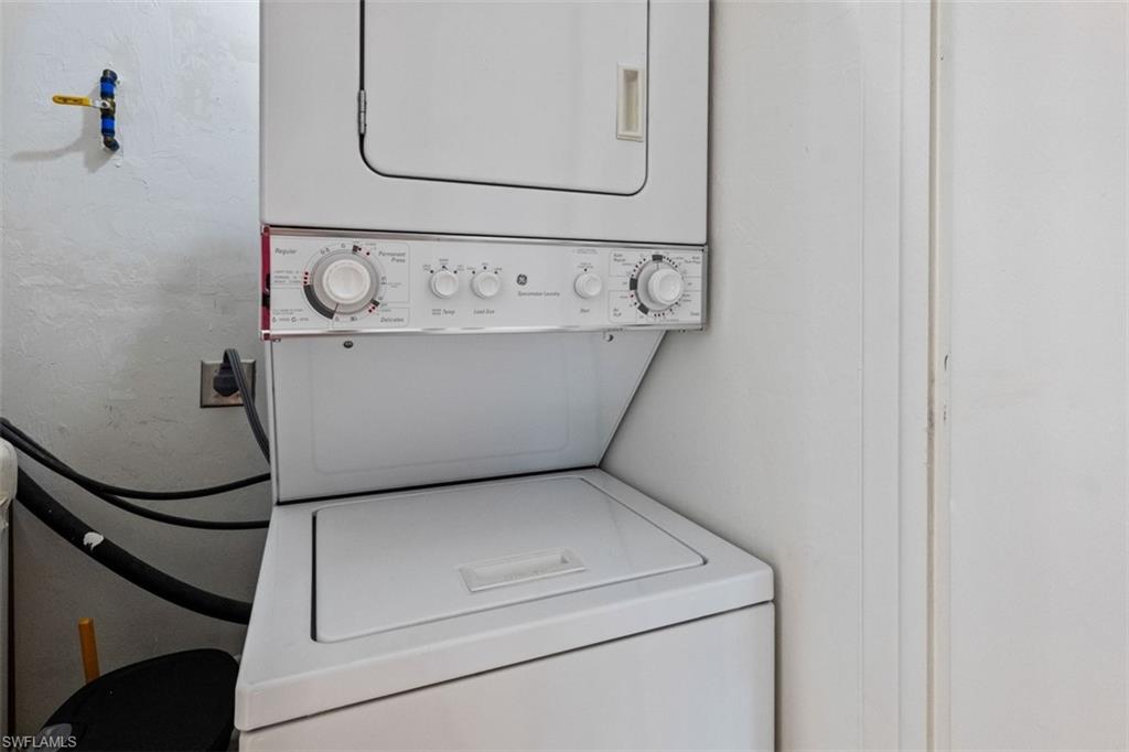 White stacked washer and dryer unit