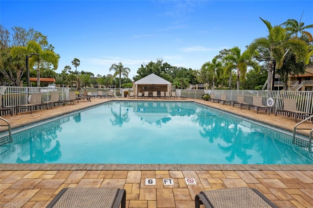 Rectangular swimming pool with a paved deck