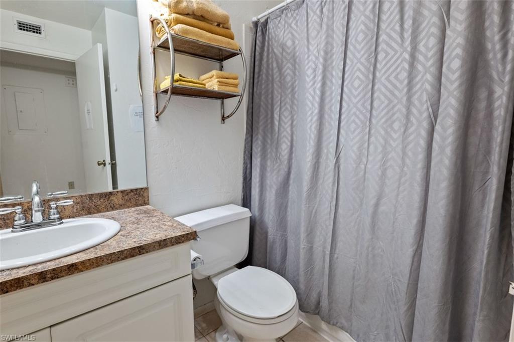 Vanity with integrated sink, chrome faucet, and spacious countertop
