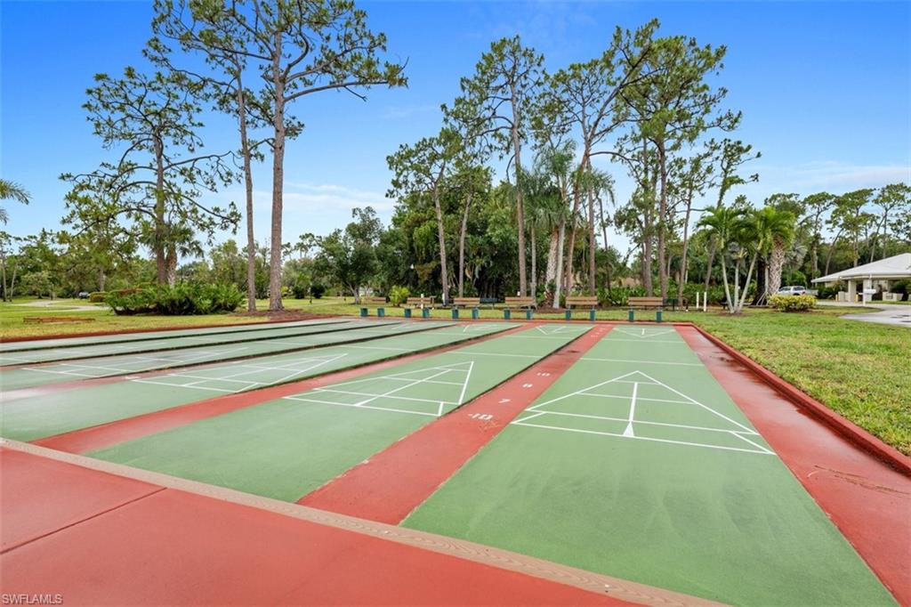 Multiple shuffleboard courts featuring a red and green surface