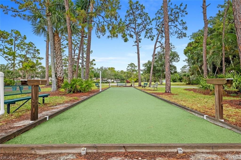 Bocce ball court featuring artificial turf and wood borders