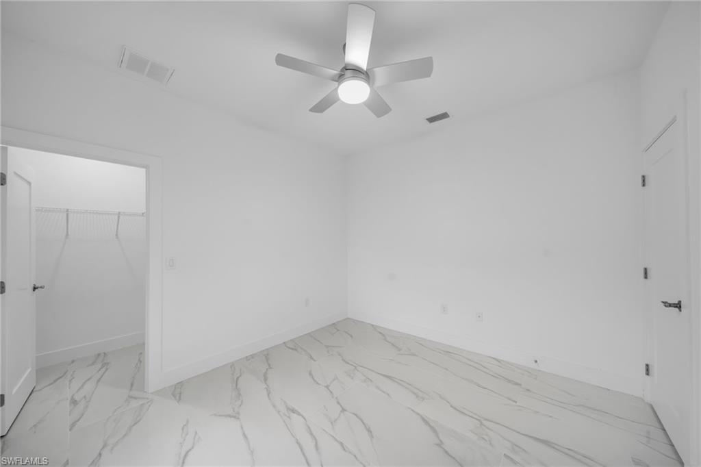 White tile flooring with subtle gray veining