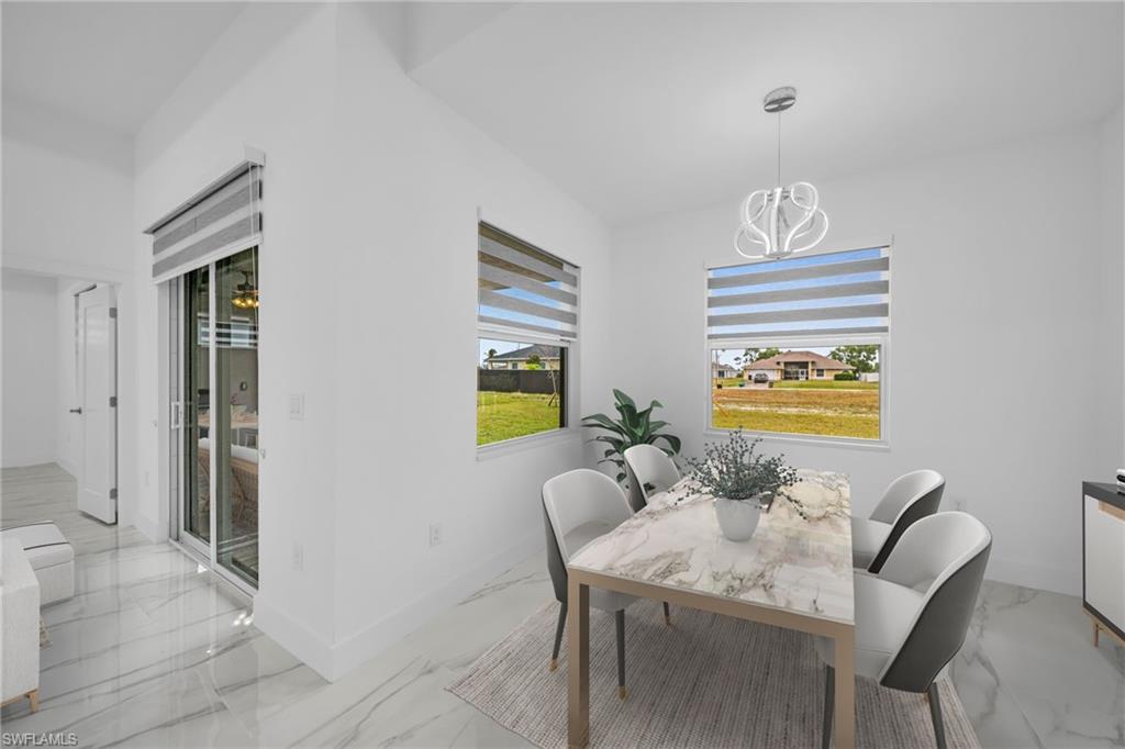 White walls with contemporary lighting, large windows, sliding glass doors, and polished tile flooring