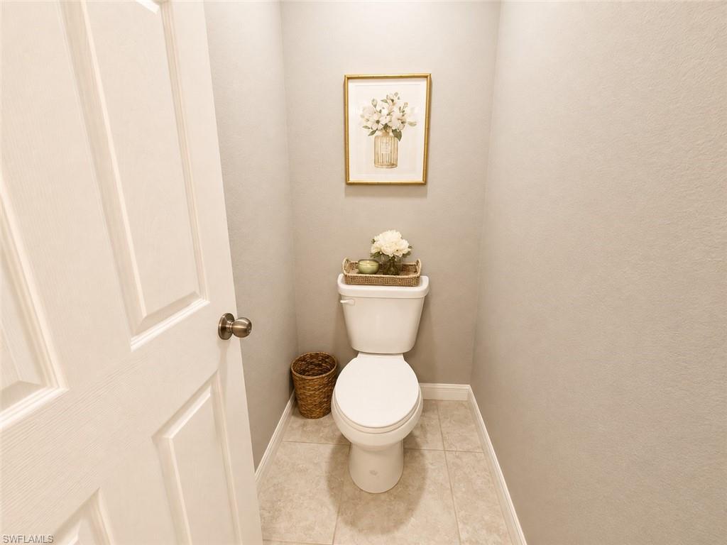 Recessed toilet within a neutral-toned room