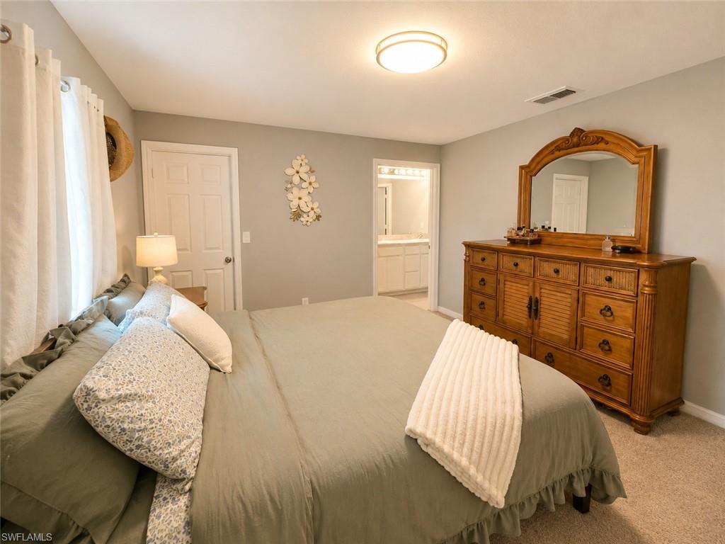 Wall-to-wall carpeting and a ceiling-mounted light fixture