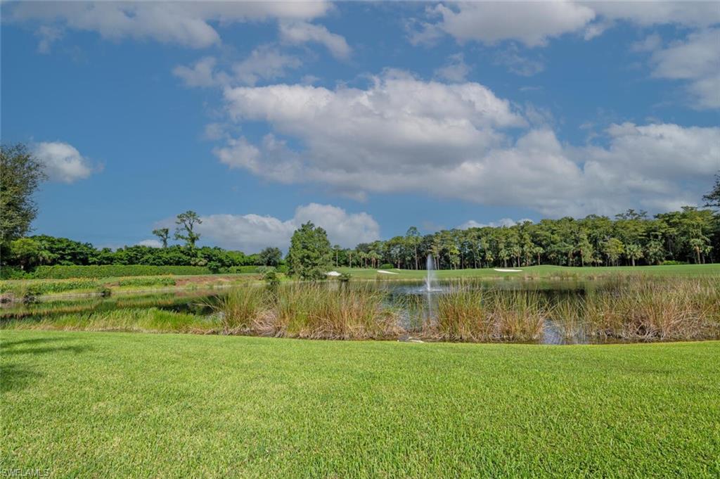 View of grassy yard featuring a water view