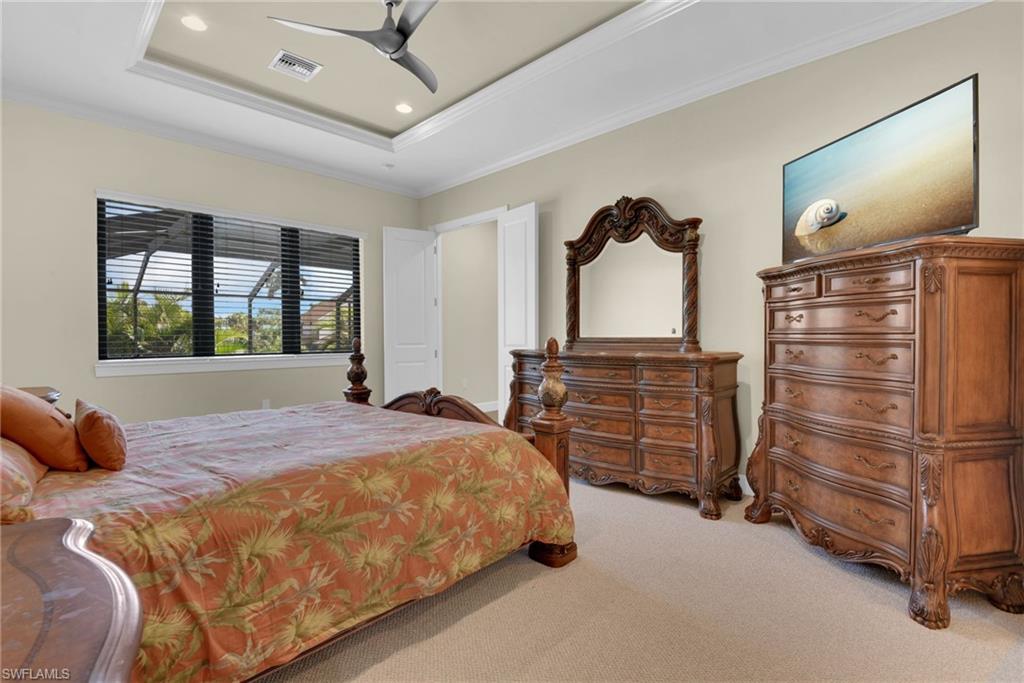 Primary Suite with Canal and Pool Views