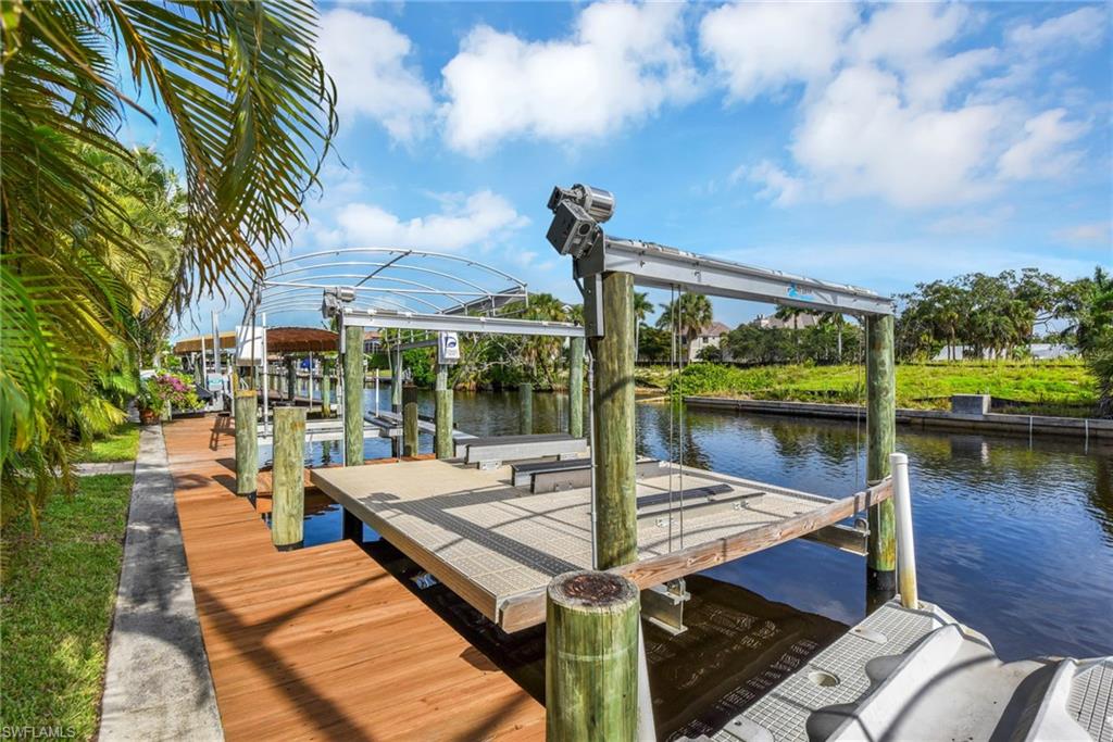 Large dock, electric 10,000 pound boat lift and electric jet ski lift