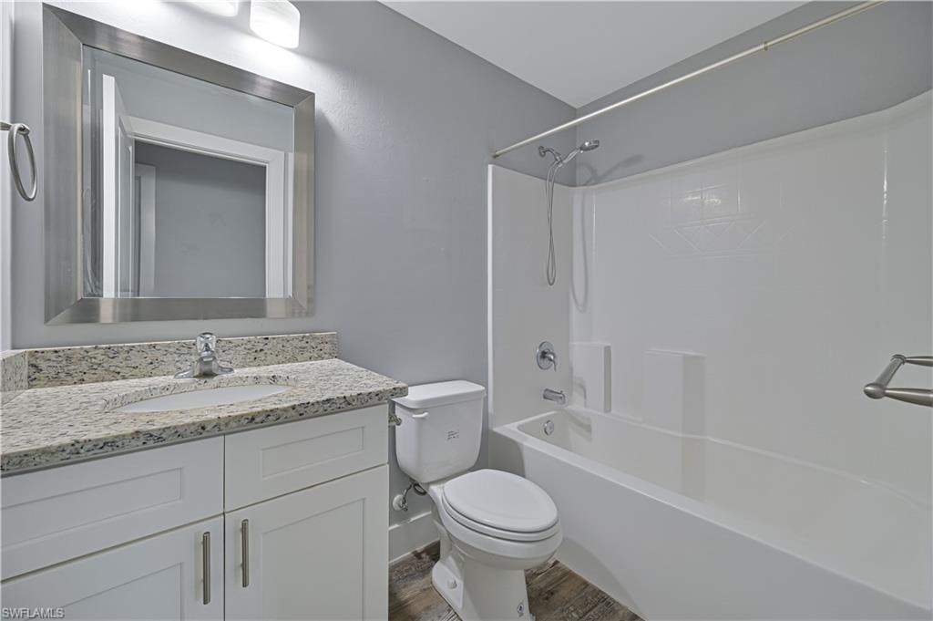 Full guest bathroom with a granite vanity, tub/shower combination, and modern finishes for family and guests.