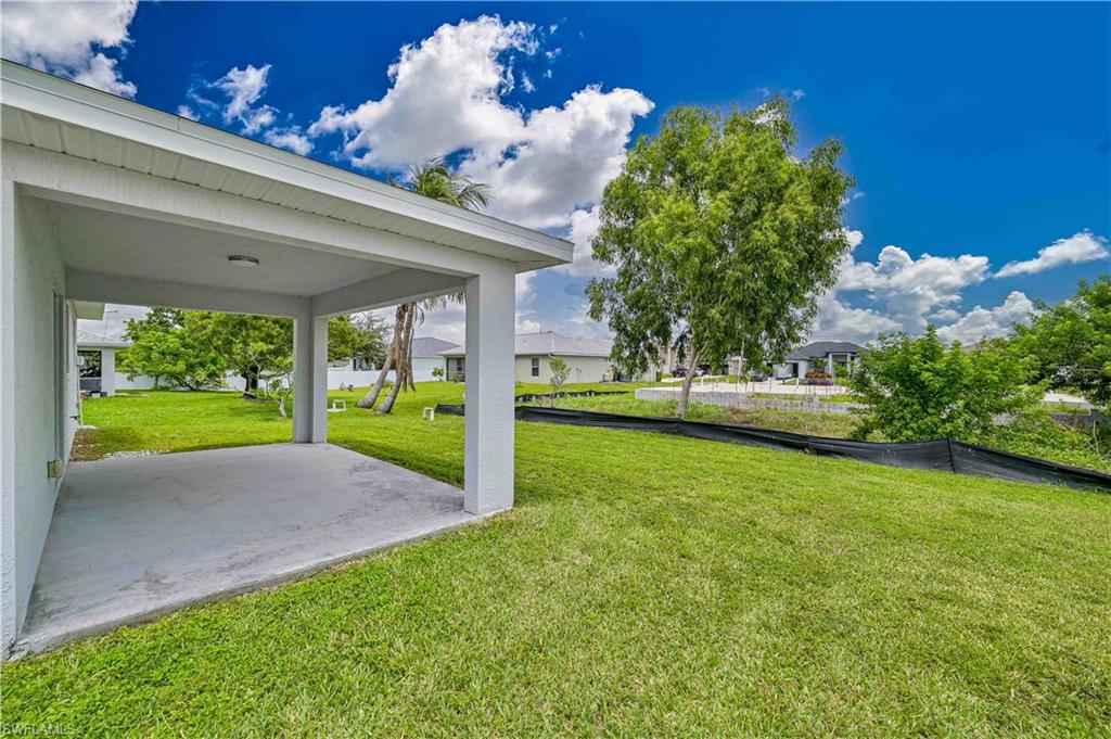 Expansive backyard with plenty of room to add a pool, create an outdoor oasis, or simply enjoy Florida living from the covered lanai.