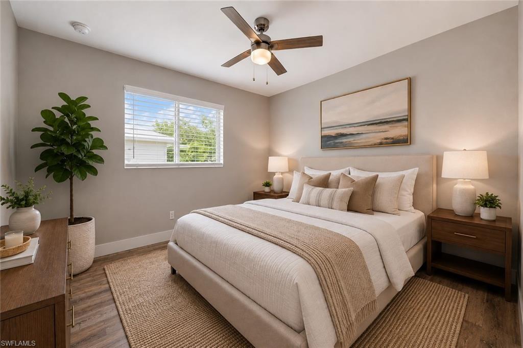 Bright guest bedroom featuring luxury vinyl plank flooring, generous closet space, and plenty of room for family or overnight guests. [Virtually Staged]