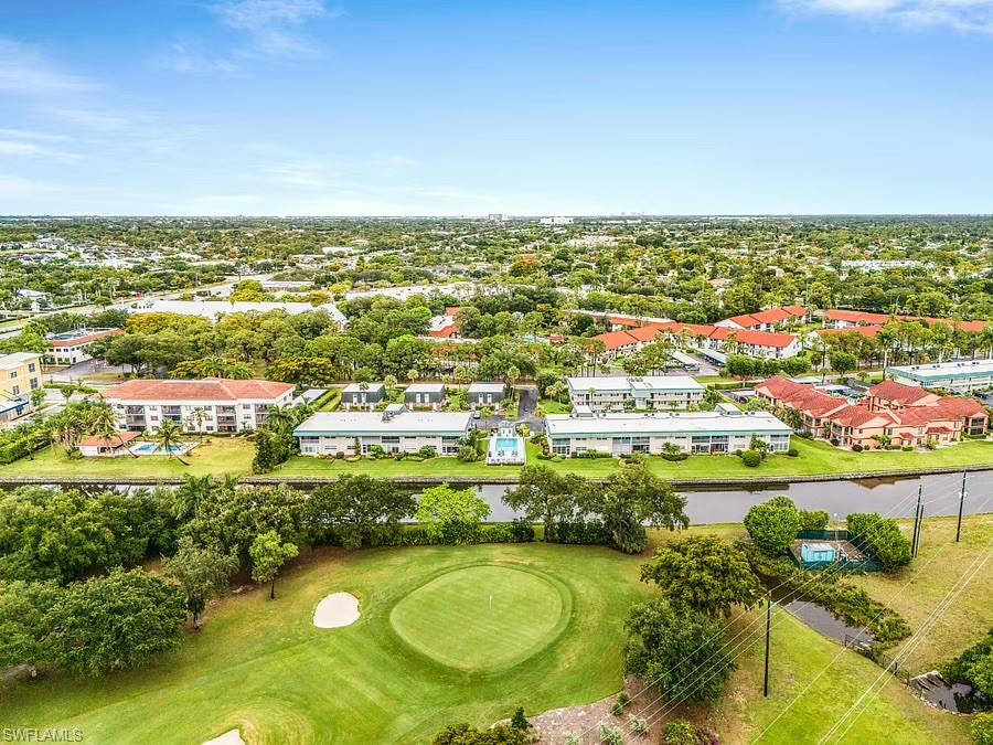 Golf course frontage, canal access, residential community, mature landscaping, and community swimming pool