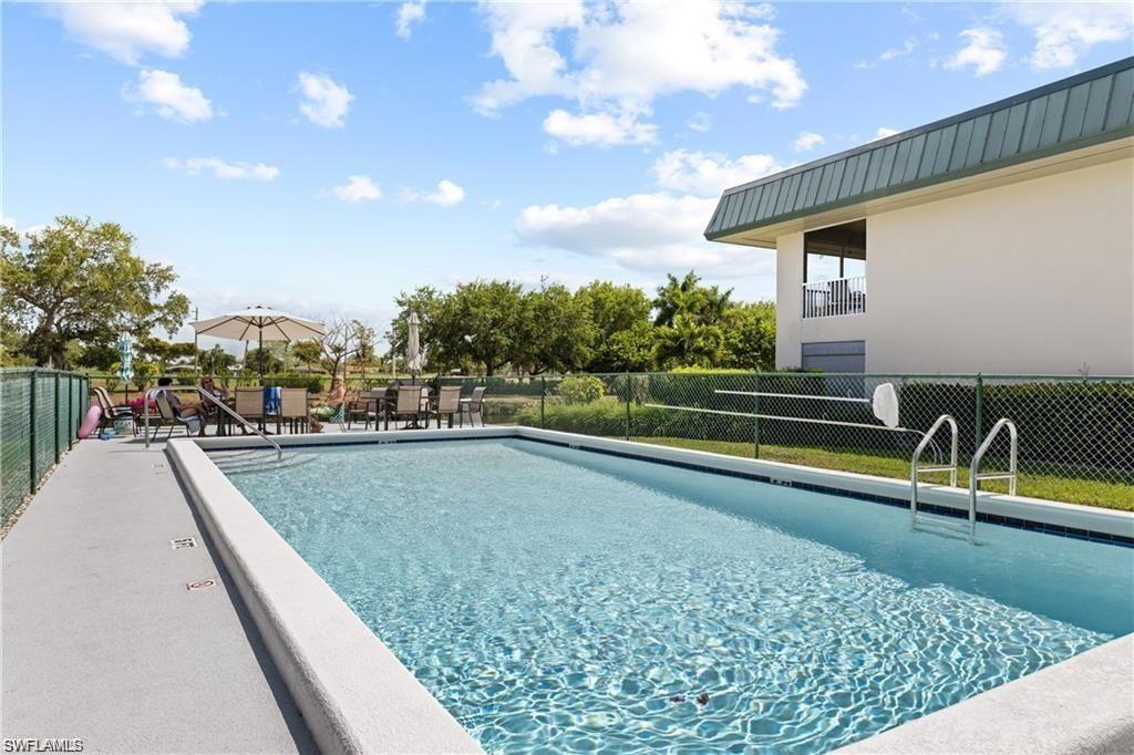 Rectangular inground pool with integrated entry steps and a surrounding concrete deck