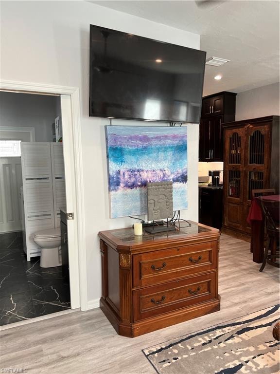 two tvs, file cabinet