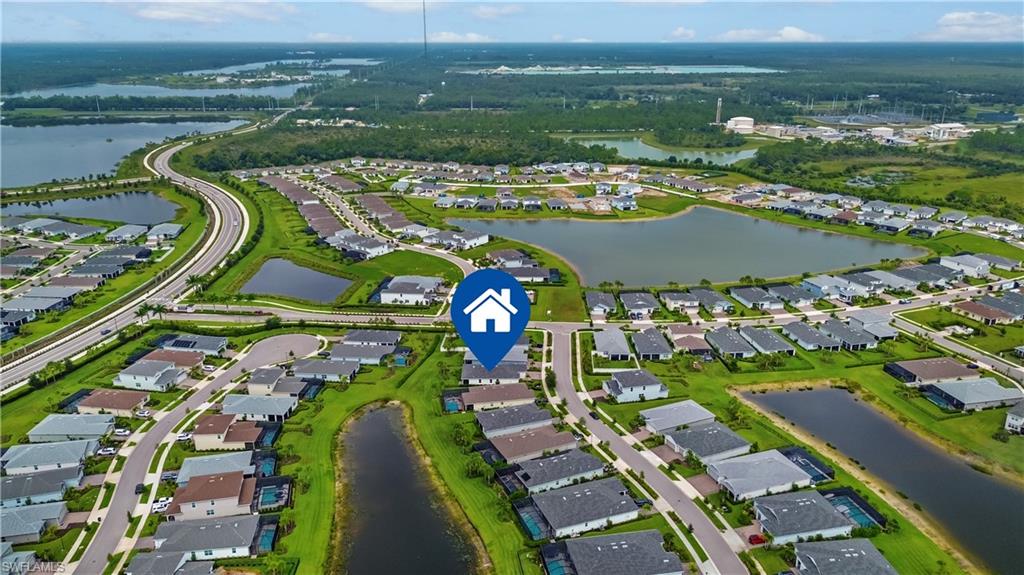 Aerial perspective showcasing a residential community with numerous homes