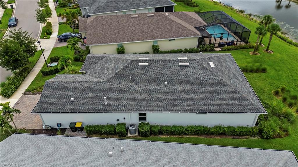 Asphalt shingle roof with multiple skylights