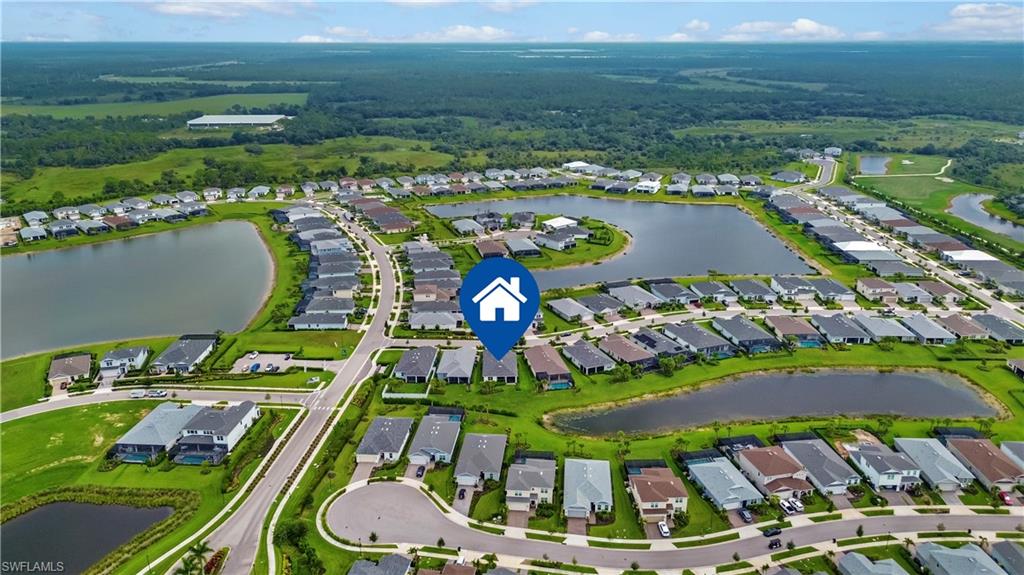 Established residential development featuring multiple water features and surrounding green spaces