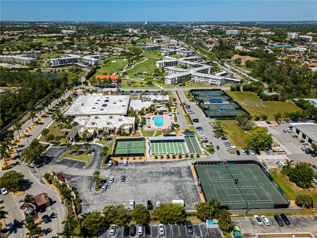 Community amenities featuring multiple tennis courts, a swimming pool, and structured recreation courts