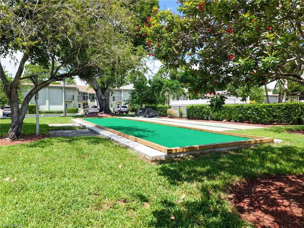 Bocce ball court with artificial turf surface and wood trim