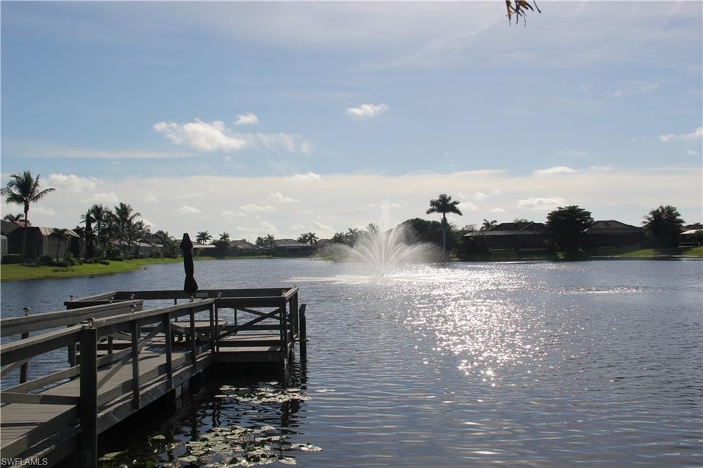 dock overlooking the pond and fountain