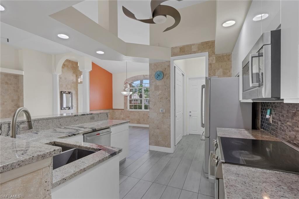 Pantry off the kitchen.  Stone accent walls