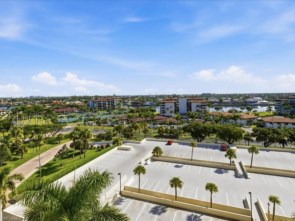 Expansive landscape featuring mature palm trees, waterways, and diverse architectural styles