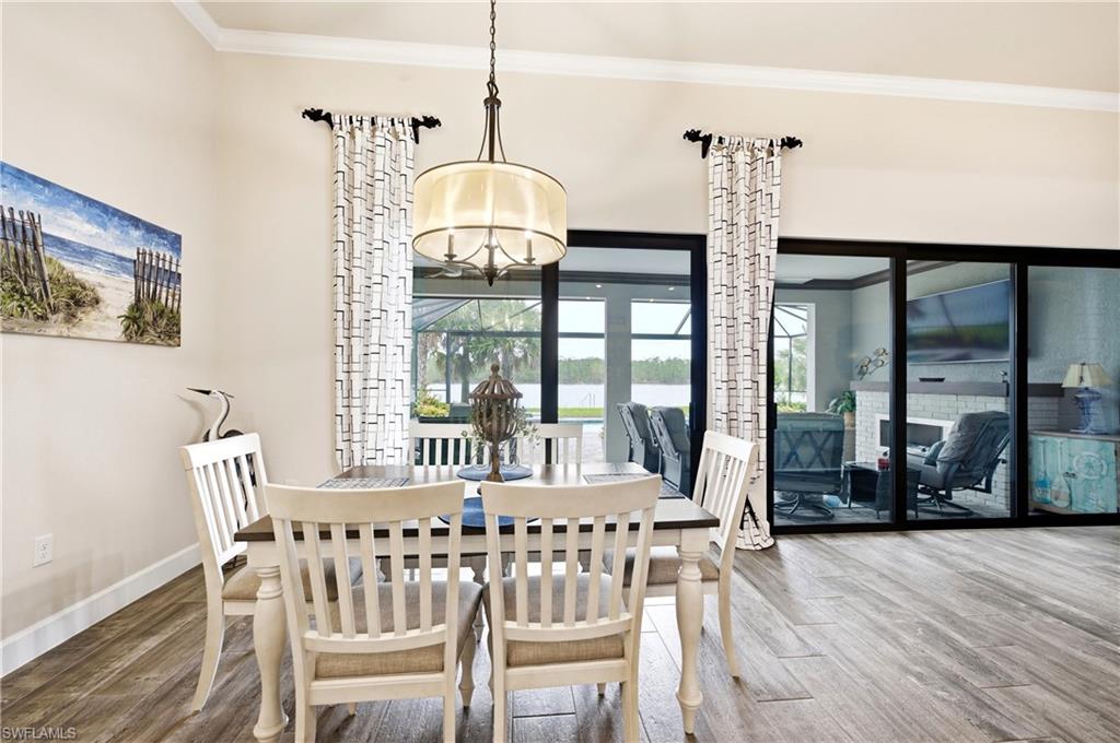 Dining area off of kitchen with beautiful lanai & lake view