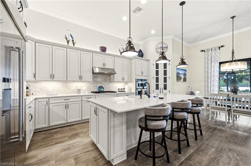 Chef's gourmet kitchen with beautiful walk-in pantry