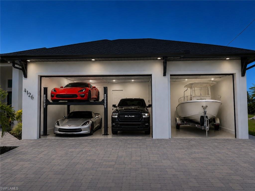 Ladies and Gentleman start your engines 2.5 miles to Burnt Store Marina add 3 lifts 9foot garage doors room for a 22 foot boat on trailer A+ Garage Space