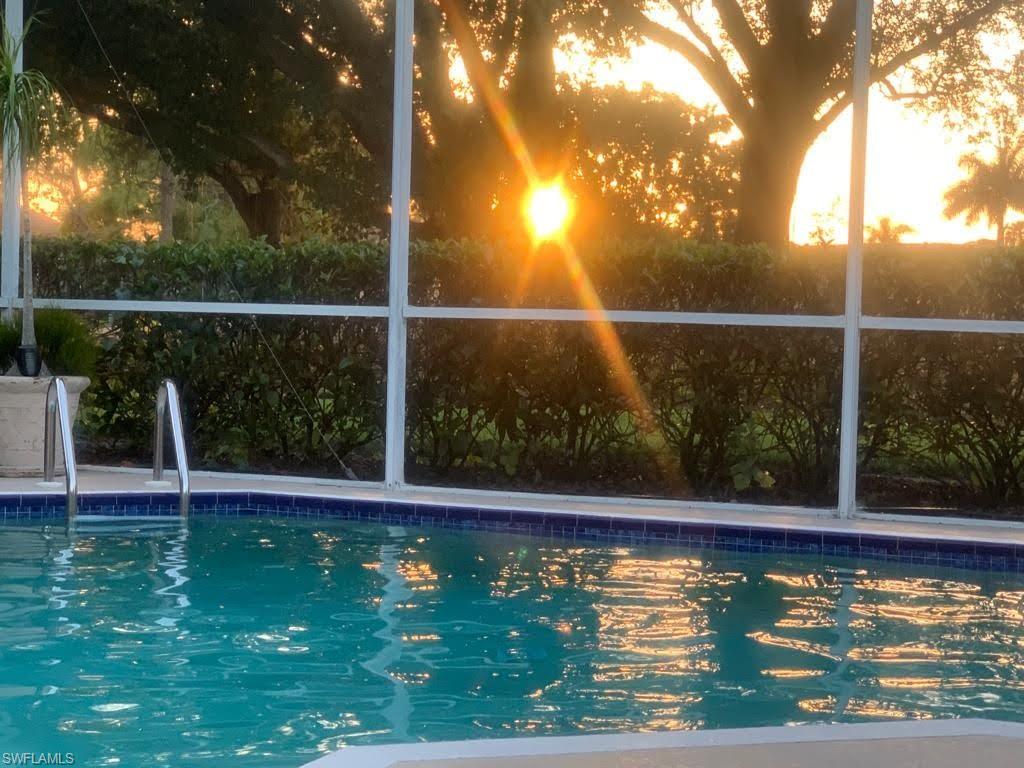 View of pool at sunset