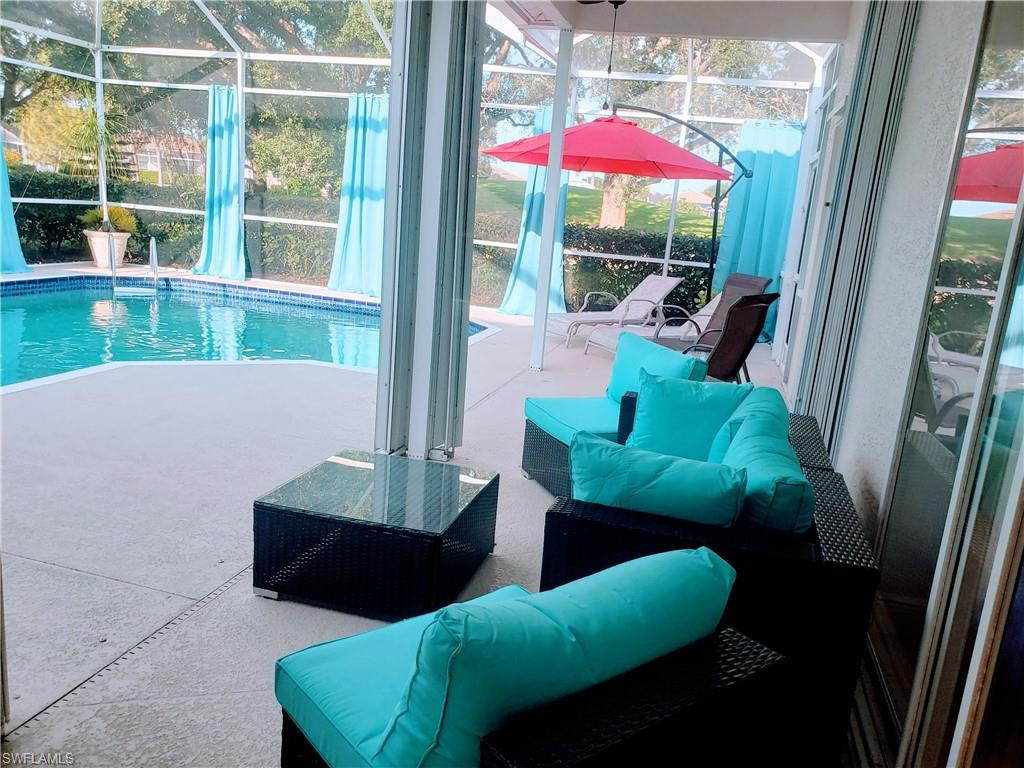 View of pool featuring a lanai and a patio