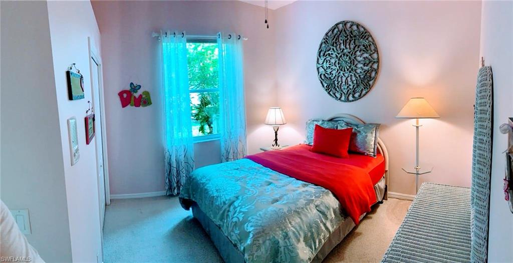 Bedroom with carpet flooring and closet