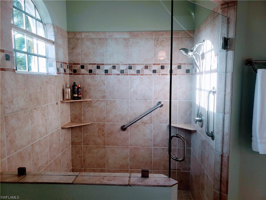 Bathroom featuring walk in shower