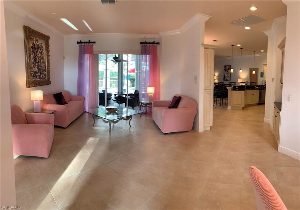 Tiled lfamily room with ornamental molding