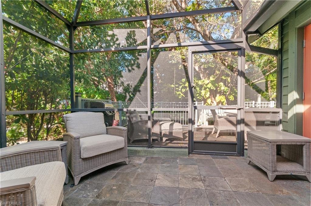Screened in porch featuring an outdoor hangout area