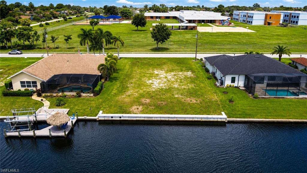 Waterfront property featuring two residences on expansive manicured grounds