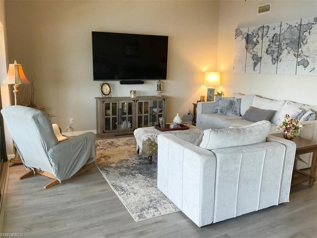 Wood-finish flooring throughout, complemented by light-toned wall paint