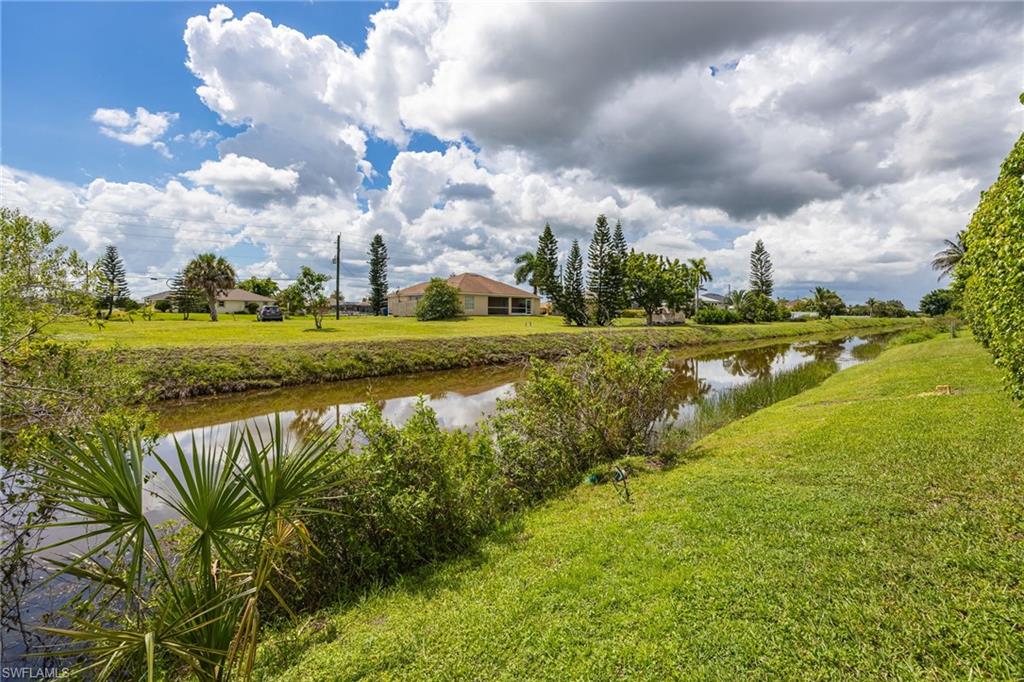 Canal-front property with established landscaping