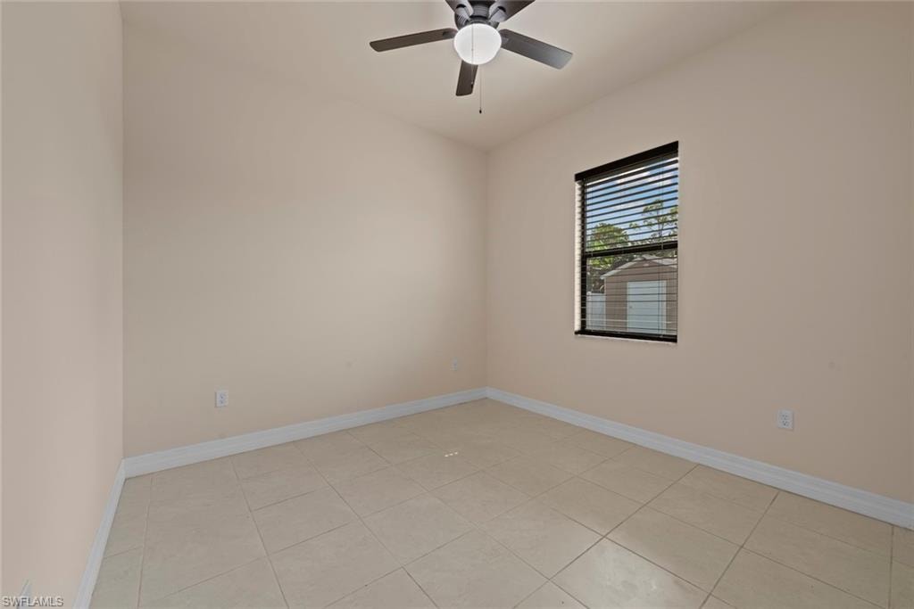 Recessed lighting, ceiling fan, and tiled flooring