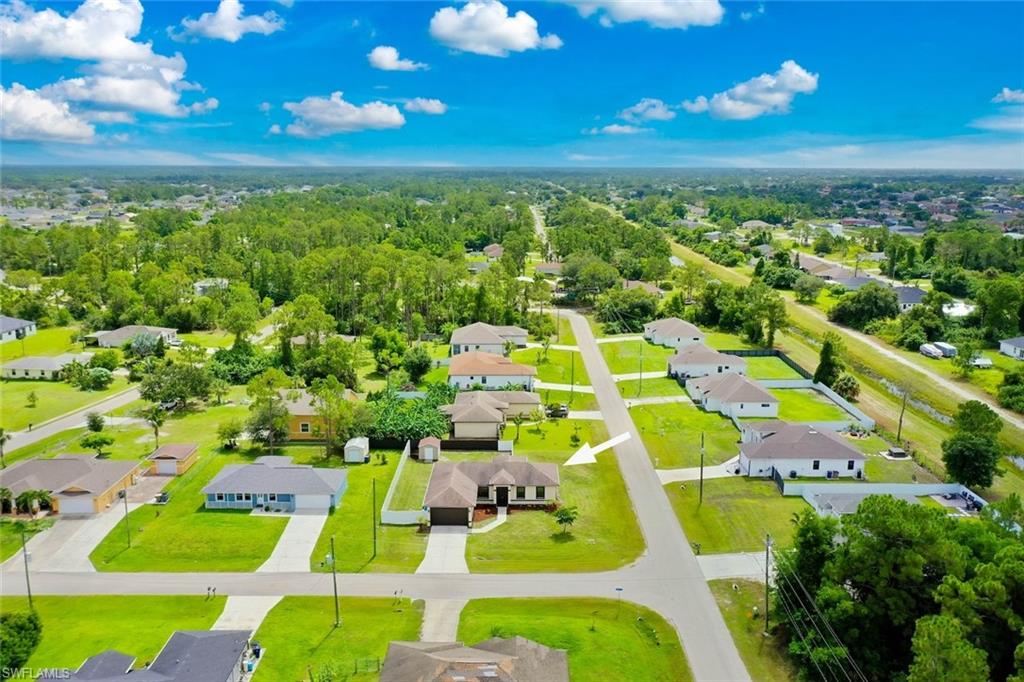 Aerial view of the property and neighborhood