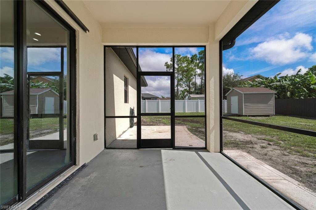 Expansive screened lanai with a door to the backyard