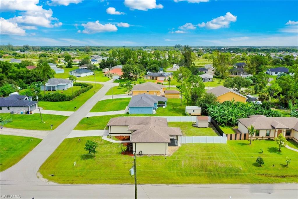 Aerial side view of the property and neighborhood