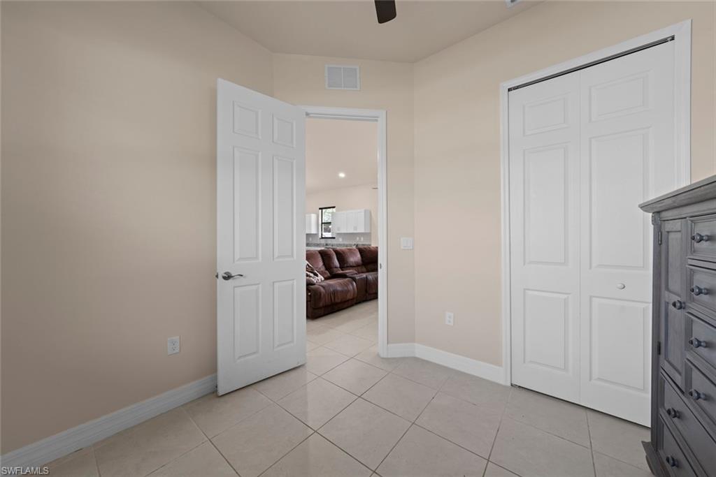 Neutral-toned walls complement the tile flooring