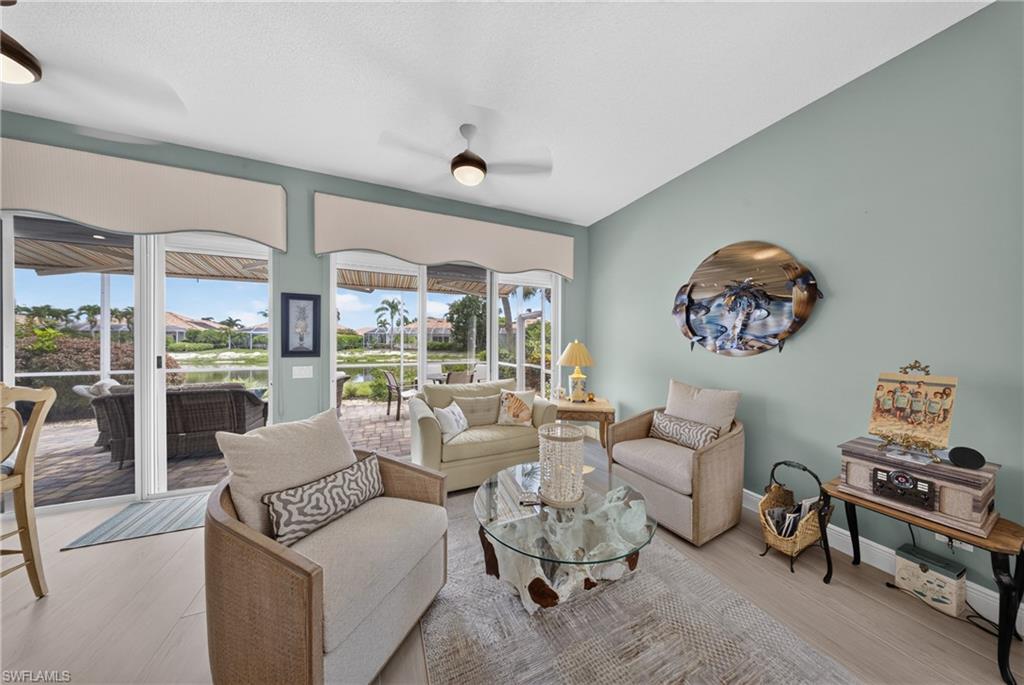 Spacious interior featuring light wood-finish flooring and a vaulted ceiling